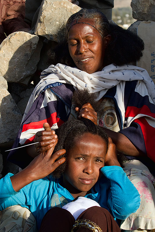 82   Hair braiding women. Ethiopia